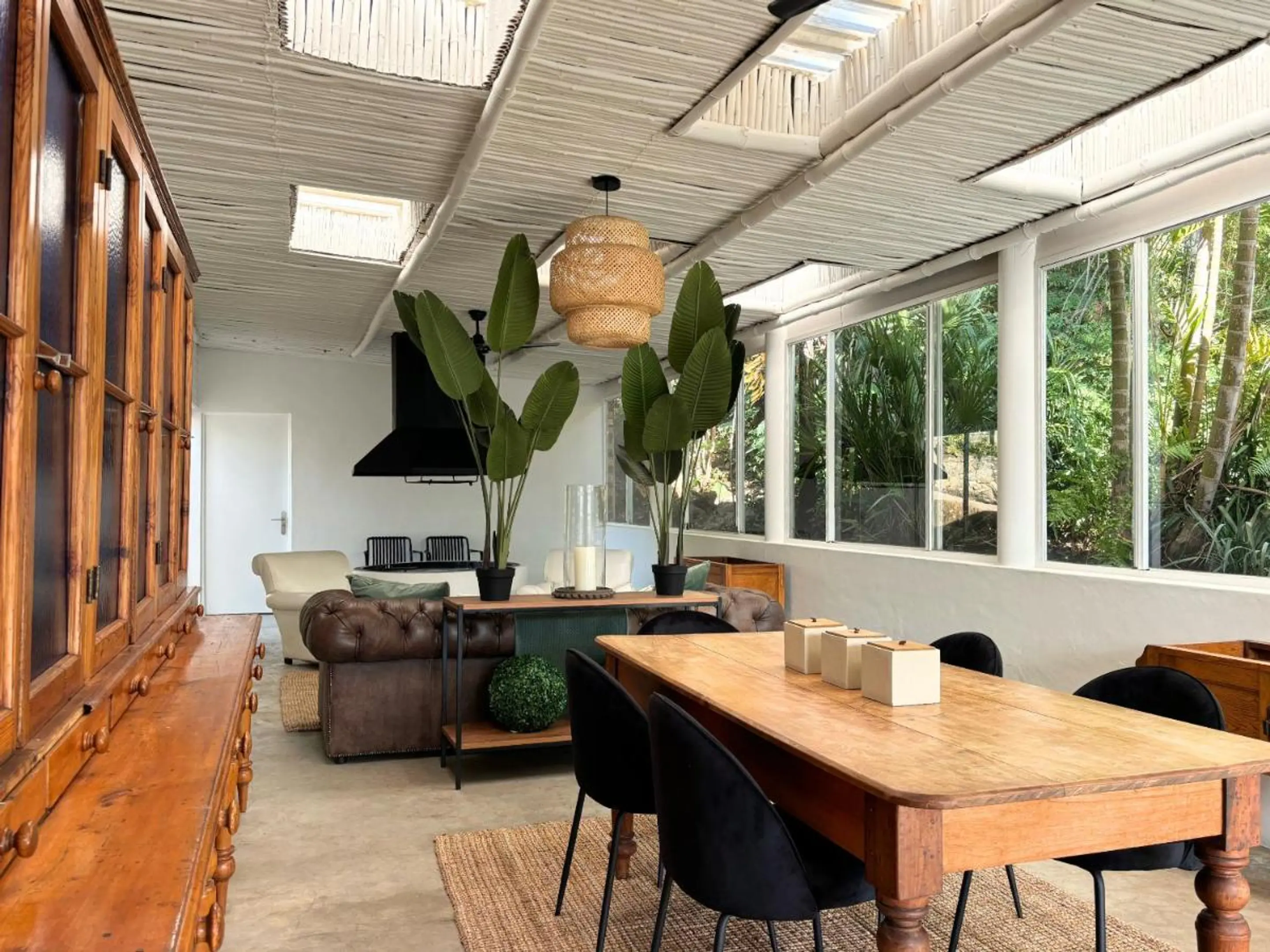 Large common area with dining, sofa and braai